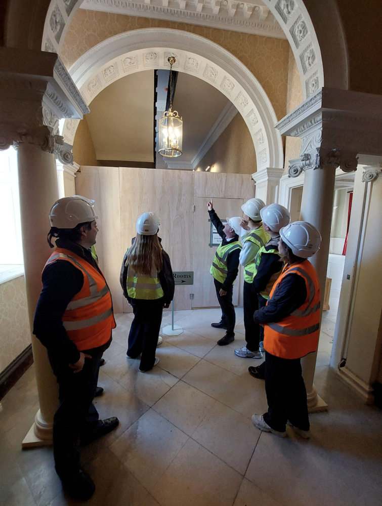 Cllr Courtliff, Joshua Coulson, Students and Cllr Tomlinson in front of the main stairway in Lydiard House