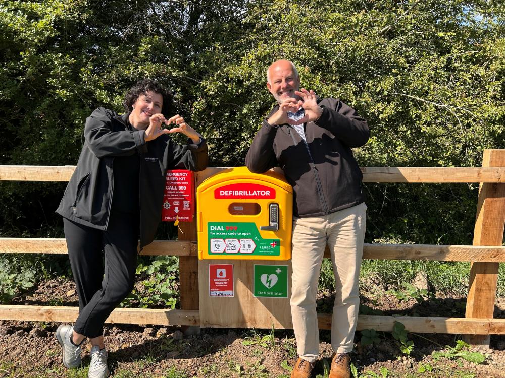 Cllr Amanda Woodhouse, Wroughton & Wichelstowe Parish Council, and Dan Pavely, Wichelstowe project director, with the onsite defibrillator and bleed kit