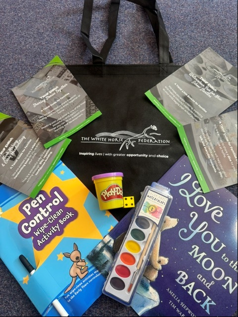 School trust gives reception pupils educational book bags