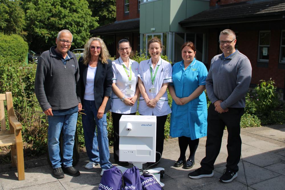 Parish council donates specialist activity table to Prospect Hospice