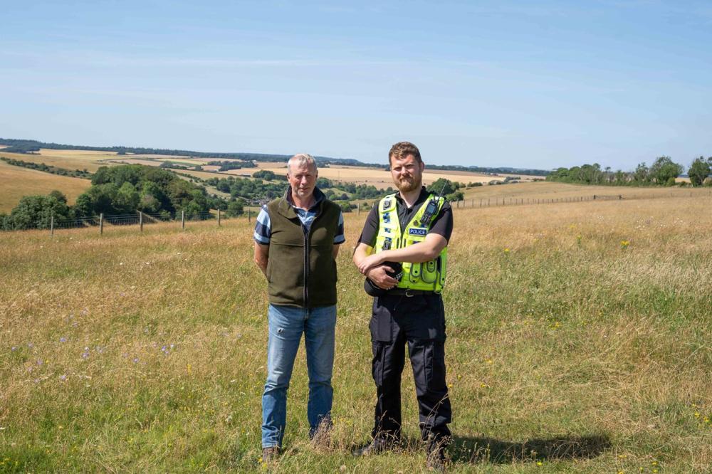 Wiltshire Wildlife Trust Farm Manager Jonathan Clarke with PC Simon Gomm at Coombe Bissett Down